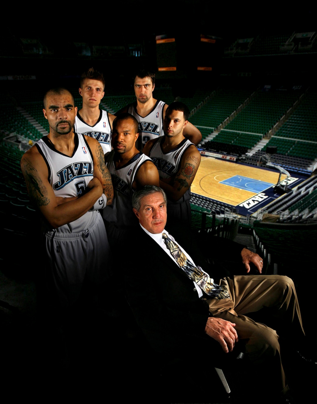 (Francisco Kjolseth  |  Tribune photo illustration) Jerry Sloan is seen surrounded by players Carlos Boozer, Andrei Kirilenko, Derek Fisher Mehmet Okur and Deron Williams prior to the 2007 playoffs.