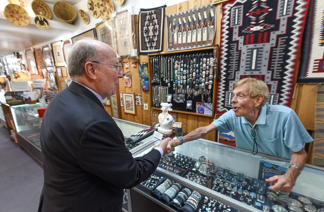 (Francisco Kjolseth  |  The Salt Lake Tribune)  George Sutton, center, a family friend for decades of Dave Dunn, owner of TP Gallery, an institution on Main Street for over 44 years, thanks him after finding a gift for a colleague that is retiring during a visit to the store on Wed. Aug. 21, 2019. The store known for some of the most authentic Native American art around the city and an outlet for Native artists is closing.