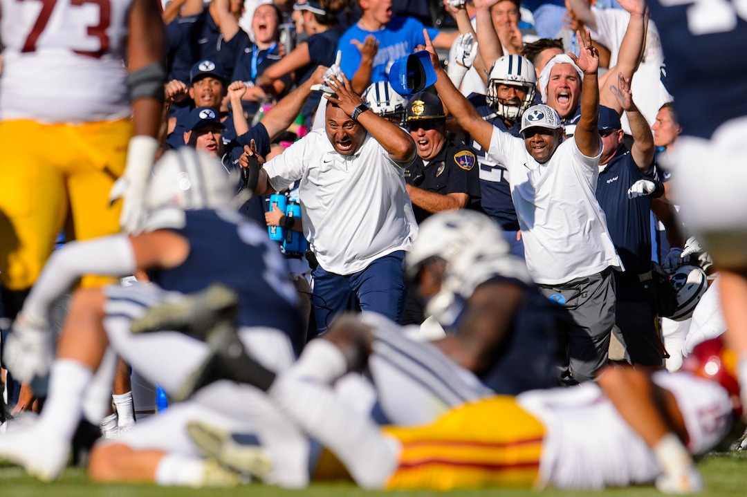 (Trent Nelson  |  The Salt Lake Tribune)  
BYU coach Kalani Sitake and the BYU sideline erupts as Brigham Young Cougars defensive back Dayan Ghanwoloku (5) makes a game-winning interception in overtime as BYU hosts USC, NCAA football in Provo on Saturday Sept. 14, 2019.