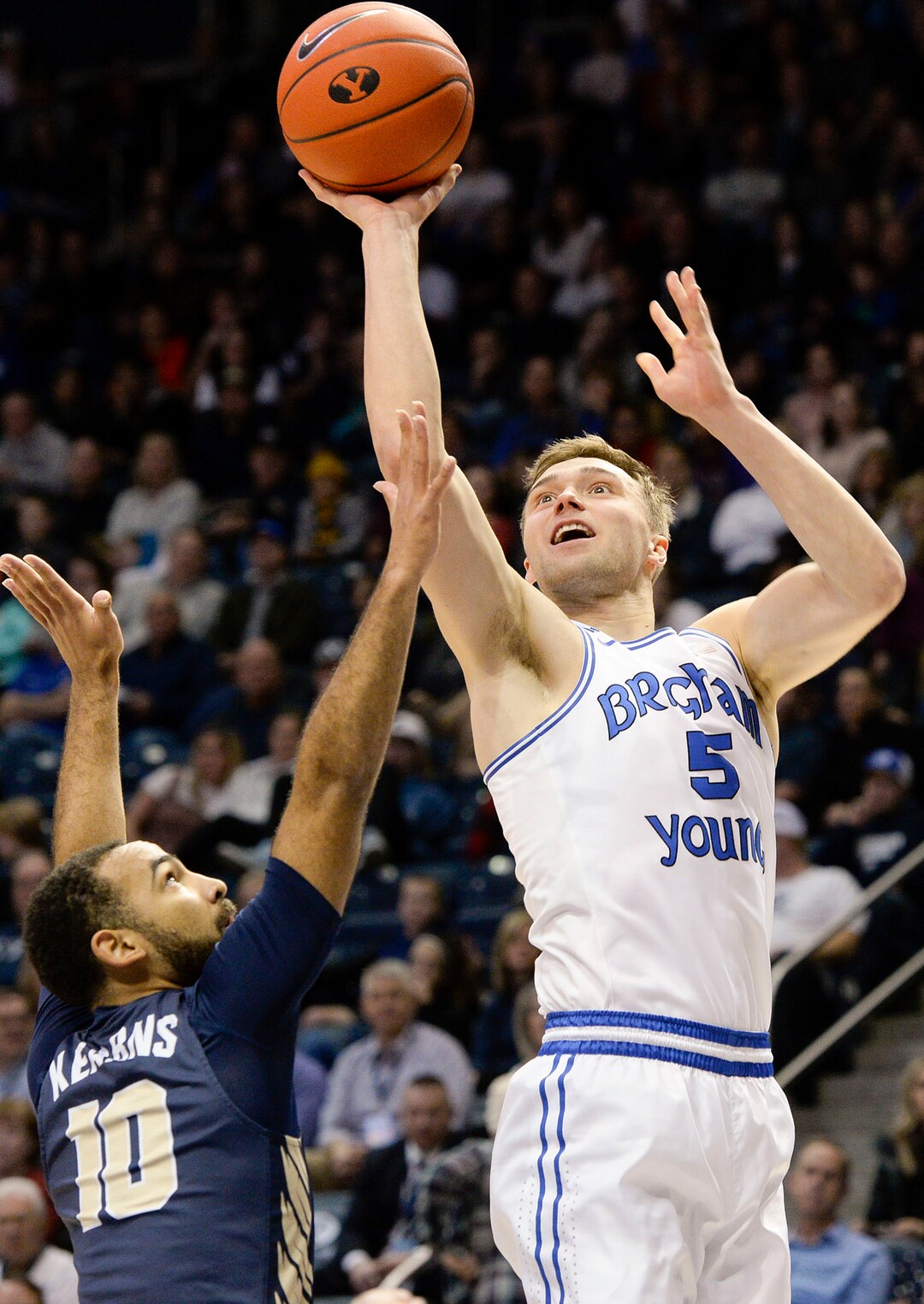 (Leah Hogsten  |  The Salt Lake Tribune) Brigham Young Cougars guard Jake Toolson (5) hits the net as Brigham Young University hosts Oral Roberts, Dec. 28, 2019 at the Marriott Center in Provo.