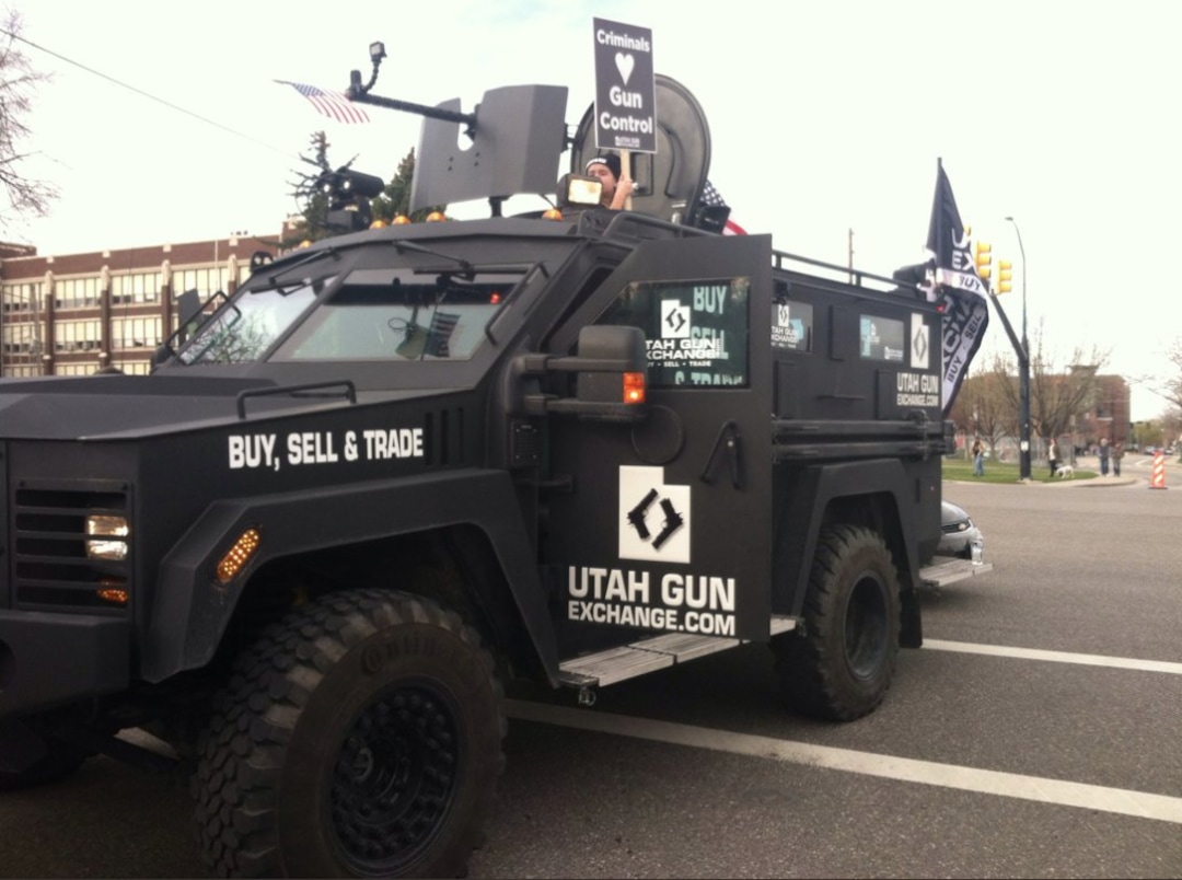 (Courtney Tanner | The Salt Lake Tribune) A military vehicle head the March Before Our Lives counter-protesters on Saturday, March 24.