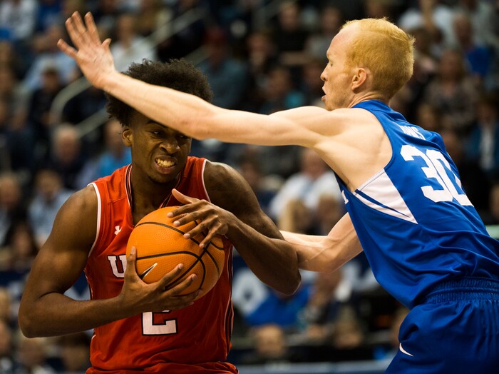 (Rick Egan  |  The Salt Lake Tribune) Utah Utes guard Kolbe Caldwell (2) draws a foul as he collides with Brigham Young Cougars guard TJ Haws (30), in basketball action Utah Utes vs. Brigham Young Cougars at the Marriott Center in Provo, Saturday, December 15, 2017.


