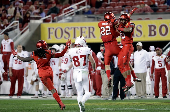 Utah defensive back Marcus Williams, right, celebrates with Chase Hansen (22) after Williams intercepted an Indiana pass during the second half of the Foster Farms Bowl NCAA college football game Wednesday, Dec. 28, 2016, in Santa Clara, Calif. Utah won 26-24. (AP Photo/Marcio Jose Sanchez)