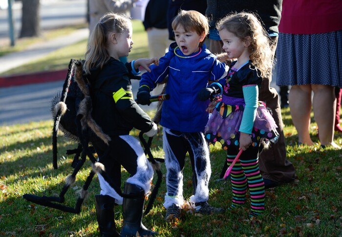 (Francisco Kjolseth  |  The Salt Lake Tribune)  Twins Eleanor and Frederick Simmon, 5, are joined by their cousin Tovah Davis, now 3, as they visit the intersection where the three who were being pulled in a wagon by their grandfather were struck by a truck turning left across traffic in Sugarhouse on Halloween two years ago. 