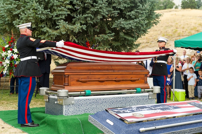 (Alex Gallivan  |  Special to The Tribune) Marine Pfc. Robert K. Holmes, who died 77 years ago aboard the USS Oklahoma during the attack on Pearl Harbor, is laid to rest in the Salt Lake City Cemetery, Monday, Aug. 20, 2018.