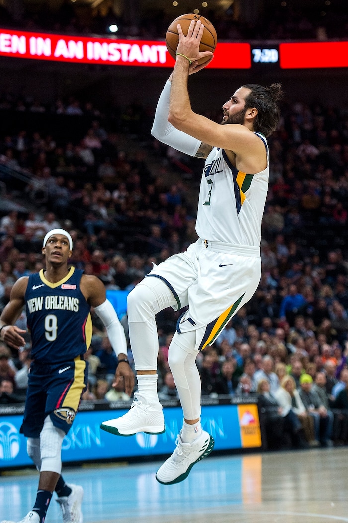 (Chris Detrick  |  The Salt Lake Tribune)  Utah Jazz guard Ricky Rubio (3) shoots past New Orleans Pelicans guard Rajon Rondo (9) during the game at Vivint Smart Home Arena Friday, December 1, 2017.  
