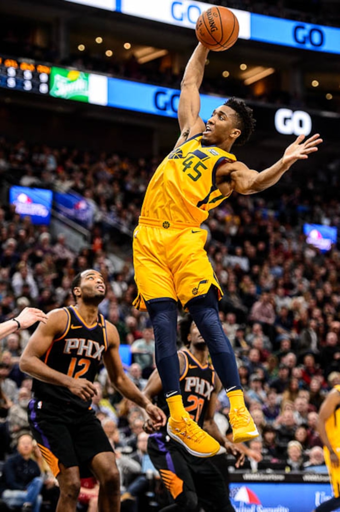(Trent Nelson | The Salt Lake Tribune)  Utah Jazz guard Donovan Mitchell (45) grabs a rebound as the Utah Jazz host the Phoenix Suns, NBA basketball in Salt Lake City, Wednesday Feb. 14, 2018.