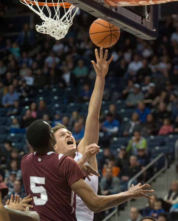 (Rick Egan  |  The Salt Lake Tribune)   Brigham Young Cougars forward Luke Worthington (41) shoots over Texas Southern Tigers center Trayvon Reed (5), in basketball action, Brigham Young Cougars vs Texas Southern Tigers, at the Marriott Center in Provo, Saturday, December 23, 2017.