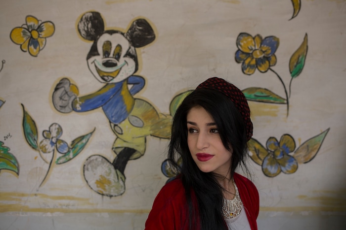 A woman waits in a queue at a polling station in a primary school to vote for Kurdish independence in the disputed city of Kirkuk, Monday, Sept. 25, 2017. Iraq's Kurdish region vote in a referendum on whether to secede from Iraq. (AP Photo/Bram Janssen)