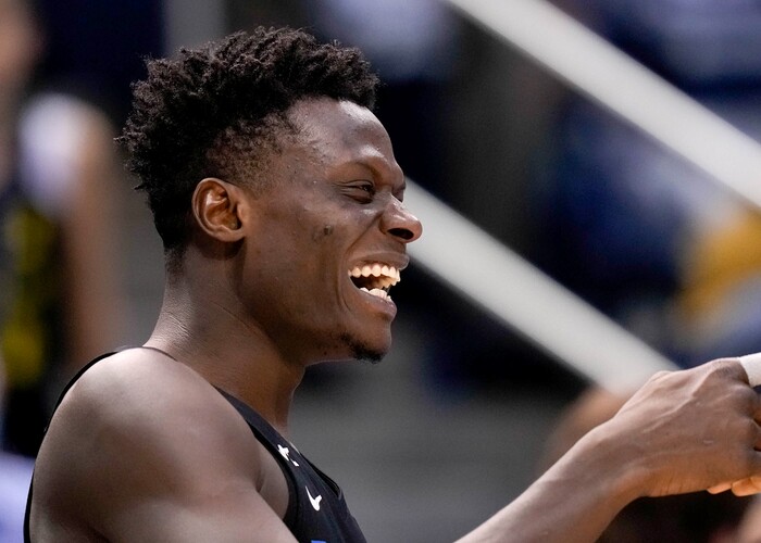 (Francisco Kjolseth | The Salt Lake Tribune) Brigham Young Cougars forward Gideon George (5) celebrates a win over the Westminster Griffins at the Marriott Center in Provo, Wednesday, Dec. 29, 2021.