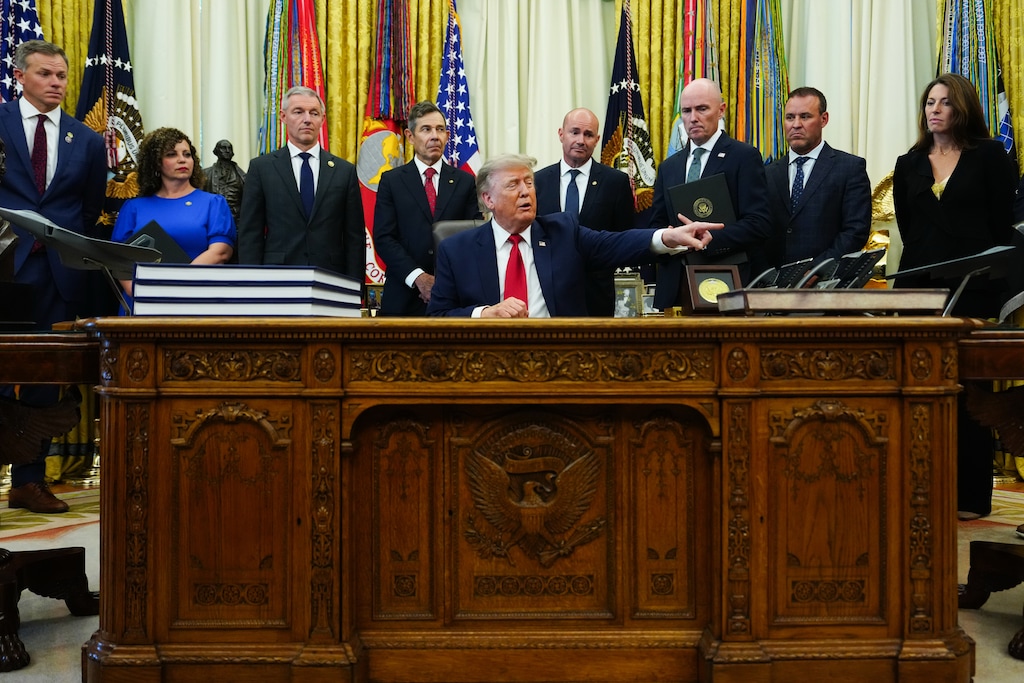 (Julia Demaree Nikhinson | AP) President Donald Trump speaks to reporters in the Oval Office of the White House, Monday, July 13, 2026, in Washington. Behind Trump, from left: U.S. Reps. Blake Moore, Celeste Maloy, and Mike Kennedy; U.S. Sens. John Curtis and Mike Lee; Gov. Spencer Cox; House Speaker Mike Schultz, R-Hooper; and Department of the Interior Deputy Secretary Kate MacGregor.