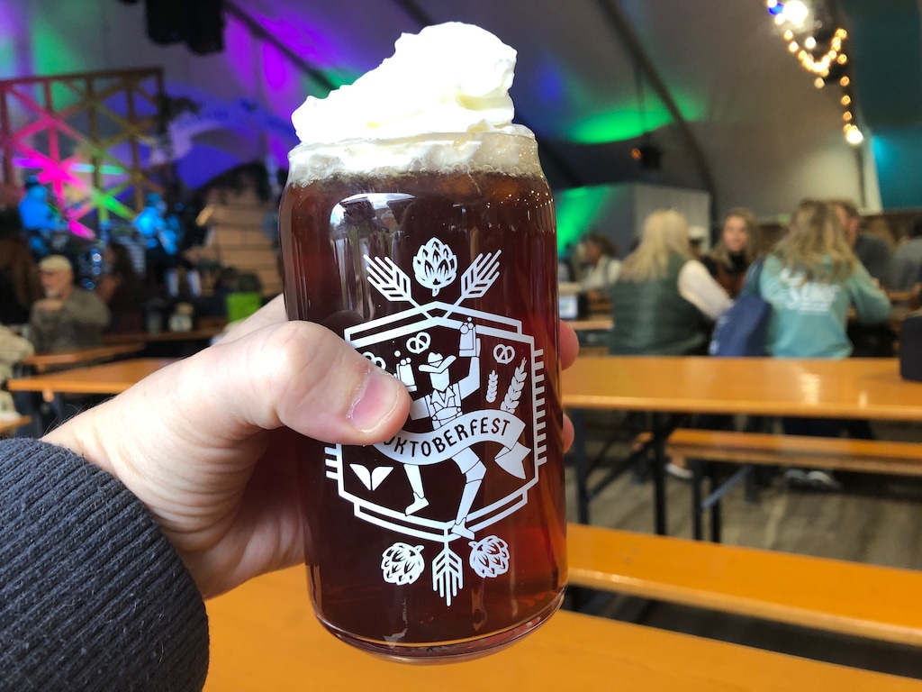 (Kolbie Peterson | The Salt Lake Tribune) A glass of Harvest Ale from RoHa Brewing Project is shown at Snowbird's Oktoberfest, topped with whipped cream.