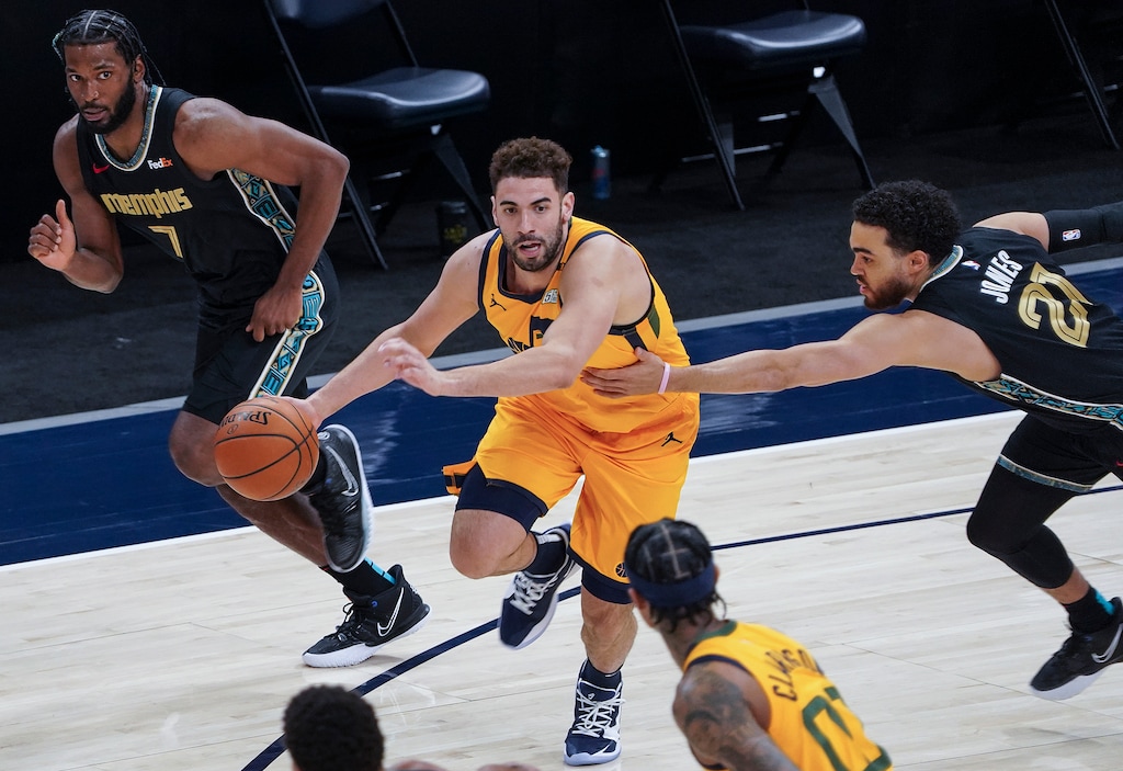 (Leah Hogsten | The Salt Lake Tribune) Utah Jazz forward Georges Niang (31) slips past Memphis Grizzlies guard Tyus Jones (21)  as the Utah Jazz host the Memphis Grizzlies, Mar. 27, 2021 at Vivint Arena. 