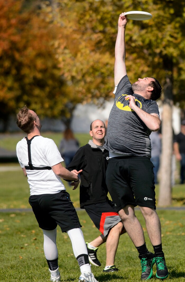 (Steve Griffin  |  The Salt Lake Tribune)  Cabrin Beard, inside sales rep for Xima Software, stretches for a catch as fellow employees play a game of Ultimate Frisbee during lunchtime on River Front Parkway in South Jordan Friday October 13, 2017.