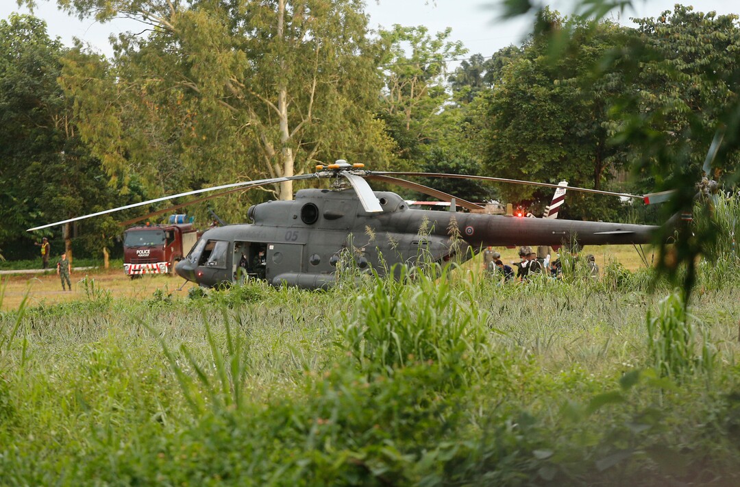 A Thai military evacuation helicopter as the remaining trapped boys and their coach are extracted from a cave in Mae Sai, Chiang Rai province, northern Thailand on Tuesday, July 10, 2018. Thai Navy SEALs say all 12 boys and their coach have been rescued from the cave, ending an ordeal that lasted more than 2 weeks. (AP Photo)