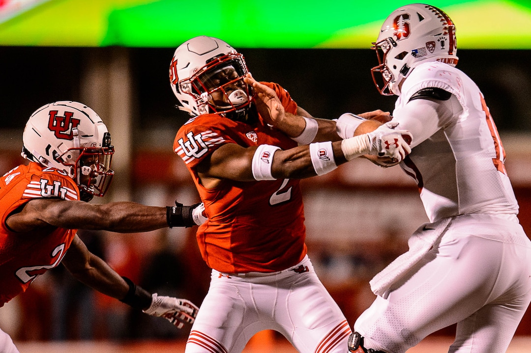 (Trent Nelson | The Salt Lake Tribune)  Utah Utes defensive back Philip Afia (2) collides with Stanford Cardinal quarterback Keller Chryst (10) as the University of Utah hosts Stanford, NCAA football at Rice-Eccles Stadium in Salt Lake City Saturday October 7, 2017.