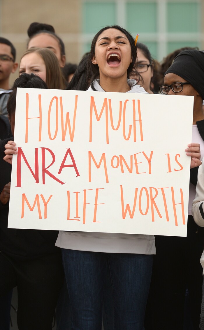 (Leah Hogsten  |  The Salt Lake Tribune) East High School student Edith Lutui left school to raise awareness and push for change with her classmates. Exactly one month after 17 people were killed at Marjory Stoneman Douglas High School in Parkland, survivors of the massacre joined tens of thousands of students across the United States by walking out of school, Wednesday, March 14, 2018. 