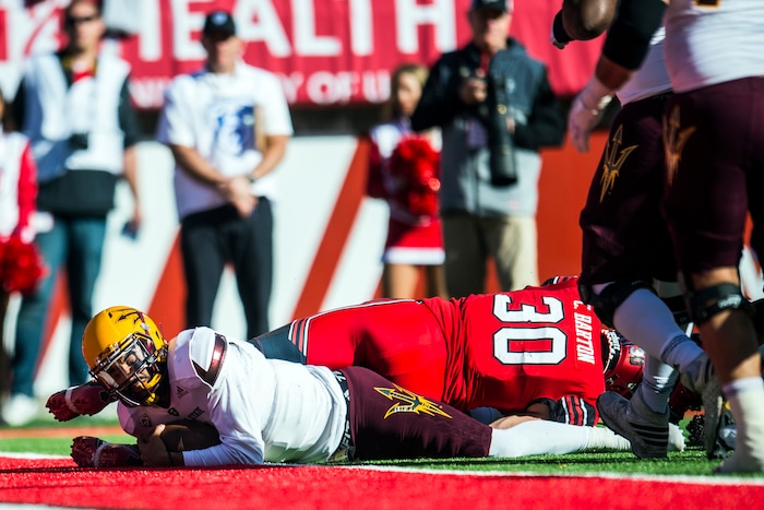 (Chris Detrick  |  The Salt Lake Tribune)  Utah Utes wide receiver Tyquez Hampton (5) scores a touchdown past Utah Utes linebacker Cody Barton (30) during the game at Rice-Eccles Stadium Saturday, October 21, 2017.  Arizona State Sun Devils defeated Utah Utes 30-10.