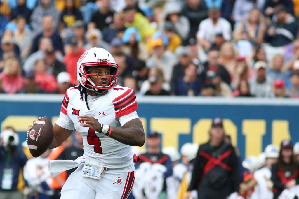 (William Wotring | AP) Utah Utes quarterback Devon Dampier (4) makes a pass during the first half of an NCAA college football game against West Virginia Mountaineers, Saturday, Sept, 27, 2025, in Morgantown, W.Va.