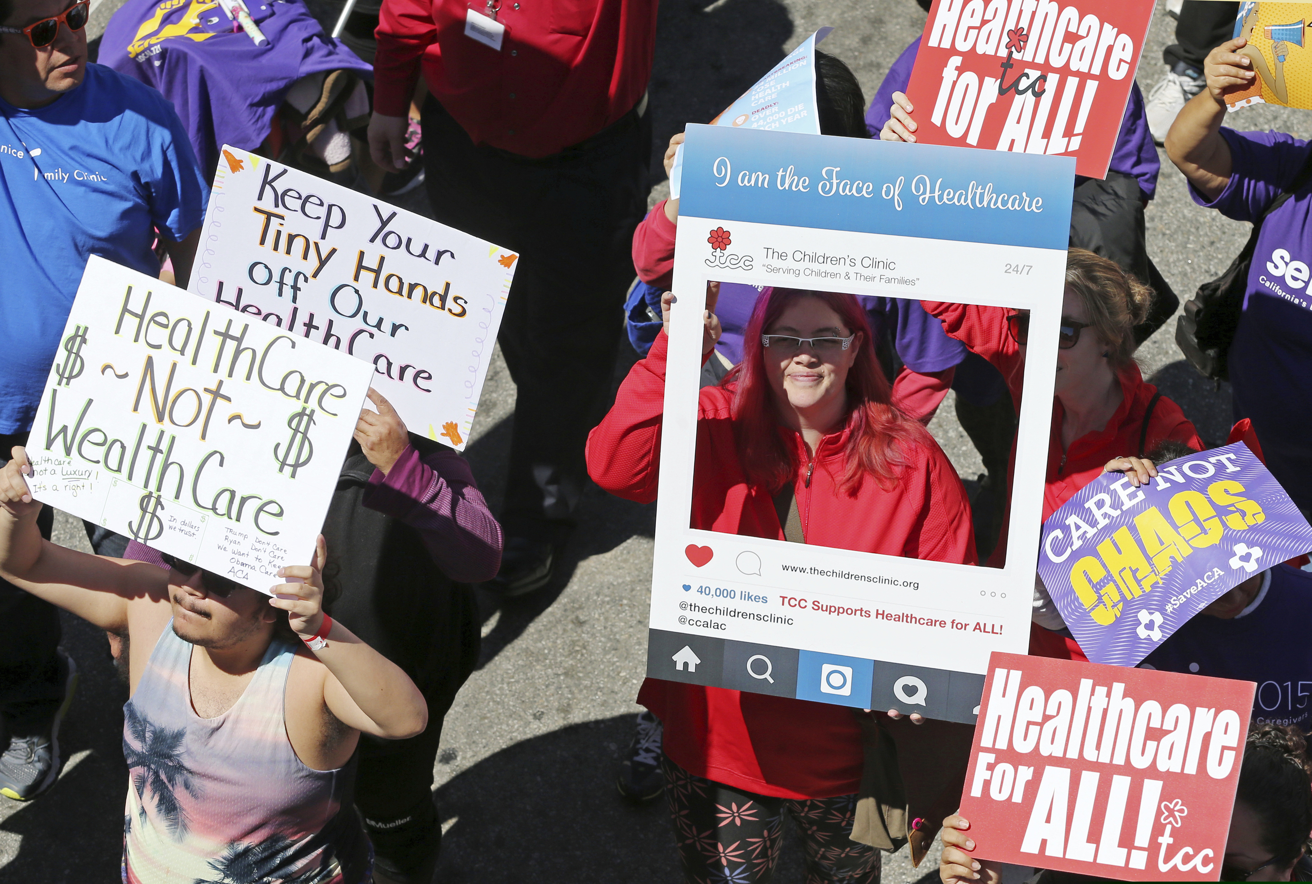 (Reed Saxon | The Associated Press) In this March 23, 2017, file photo, hundreds of people march through downtown Los Angeles protesting President Donald Trump's plan to dismantle the Affordable Care Act, his predecessor's signature health care law. Health care proposals are among the first actions for some new Democratic governors and Democratically controlled legislatures. Expanding access to care was a rallying point for the party in the 2018 elections. The early proposals fall short of universal health care but are generally seen as steps that will get states closer to full health coverage for their residents.
