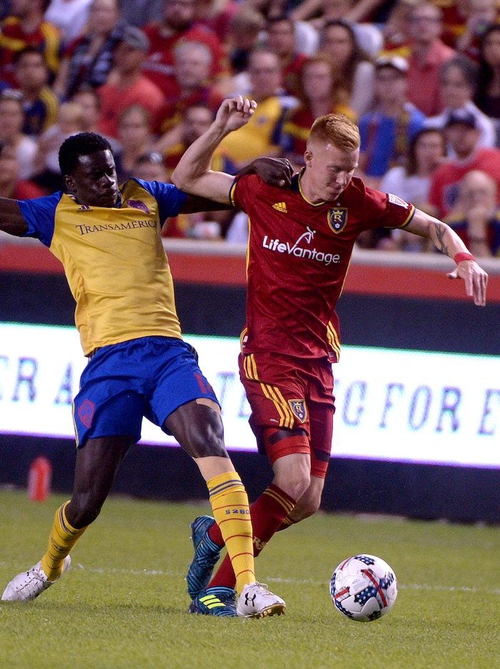 (Leah Hogsten  |  The Salt Lake Tribune)  Real Salt Lake defender Justen Glad (15) battles Colorado Rapids forward Dominique Badji (14). Real Salt Lake are 2-0 against the Colorado Rapids for the Rocky Mountain Cup at Rio Tinto Stadium, Saturday, August 26, 2017. 