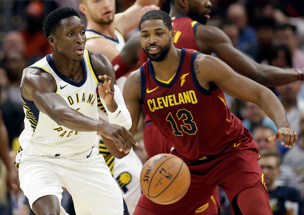 Indiana Pacers' Victor Oladipo (4) passes against Cleveland Cavaliers' Tristan Thompson (13) in the first half of an NBA basketball game, Wednesday, Nov. 1, 2017, in Cleveland. (AP Photo/Tony Dejak)