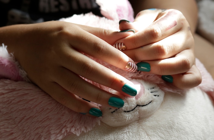 (Lynne Sladky | The Associated Press) In this Monday, March 13, 2017 photo, Theo Ramos, 15, holds his stuffed toy named Strawberry as he sits in his bedroom in Homestead, Fla. “I’m a demi boy,” Theo says. “For me, it’s a person who doesn’t identify completely as male. Fifty percent male. Fifty percent gender neutral. That’s how I identify it."
