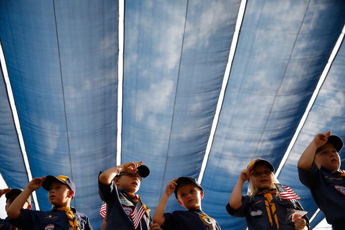 (Daniel Carde | for The Salt Lake Tribune) Cub Scouts from Troop 1456 perform the Pledge of Allegiance before the World Folkfest at the Springville Arts Park, Springville, Thursday, Aug. 1, 2018.
