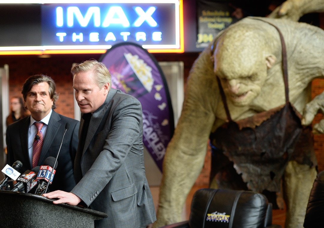 (Francisco Kjolseth  |  The Salt Lake Tribune) Trolls from the latest release of the Hobbit act as a backdrop for the date announcement of FanX by Bryan Brandenburg, left, and Dan Farr, co-founders of the Salt Lake Comic Con. Cosplayer fans were on hand for the Jan. 29-31 2015 the press announcement at the Megaplex 17 at Jordan Common in Sandy on Wednesday, Nov. 19, 2014.