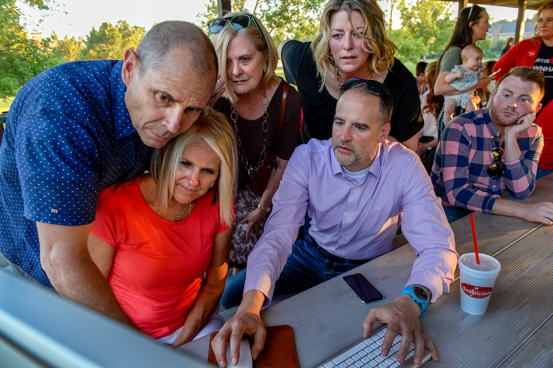 Leah Hogsten  |  The Salt Lake Tribune  l-r Rep. John Curtis, wife Sue Curtis, Lorie Fowlke, Adrielle Herring and Corey Norman read early election night results, shortly after the polls closed, June 26, 2018 at his election party at Riverview Park in Provo.  Curtis defeated Republican primary opponent Chris Herrod for the 3rd Congressional District seat.