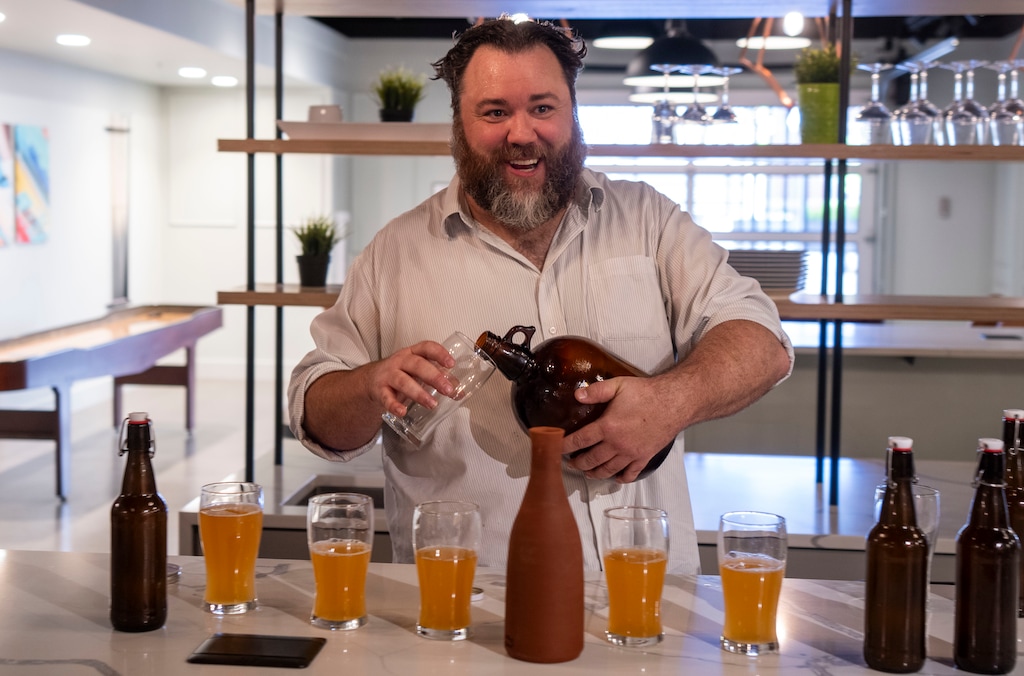 (Rick Egan | The Salt Lake Tribune)  Dylan McDonnell pours a cup of his ancient beer, during a beer tasting at the Salt Lake Tribune, on Thursday, May 16, 2024.