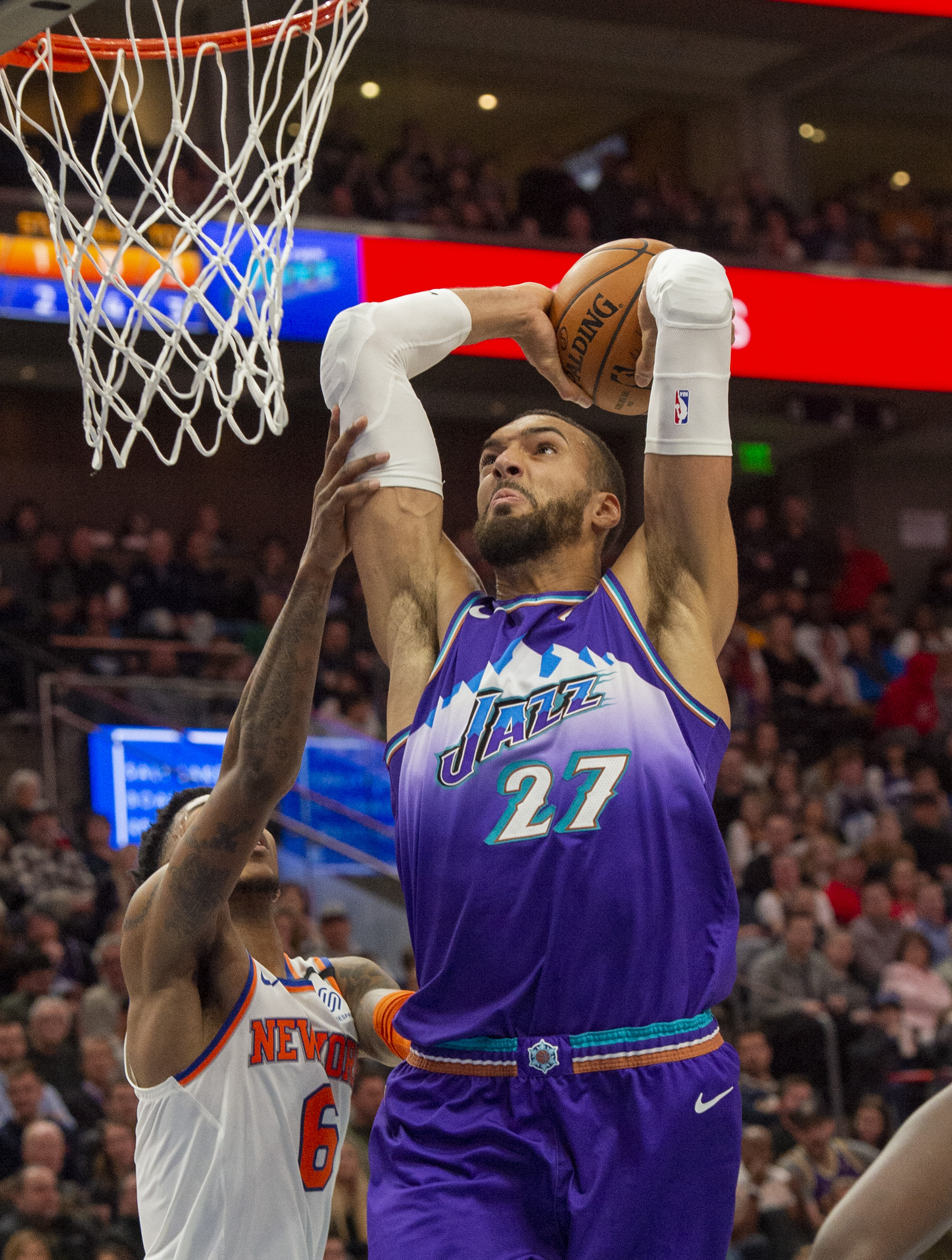 (Rick Egan  |  The Salt Lake Tribune)      Utah Jazz center Rudy Gobert (27) goes in for a slam dunk as New York Knicks guard Elfrid Payton (6) defends, in NBA action between the Utah Jazz and the New York Knicks, in Salt Lake City, Wednesday, Jan. 8, 2020.