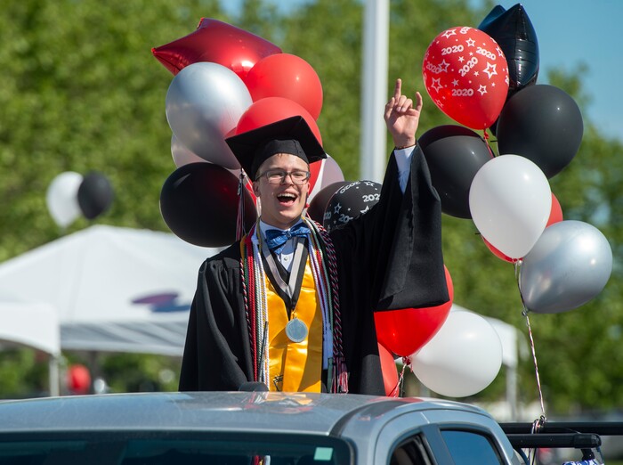 (Rick Egan  |  The Salt Lake Tribune)     Blake Doty joins the other Alta High seniors in the parade of 2020 graduates in a “drive through” graduation ceremony at Alta High, Thursday, May 28, 2020.