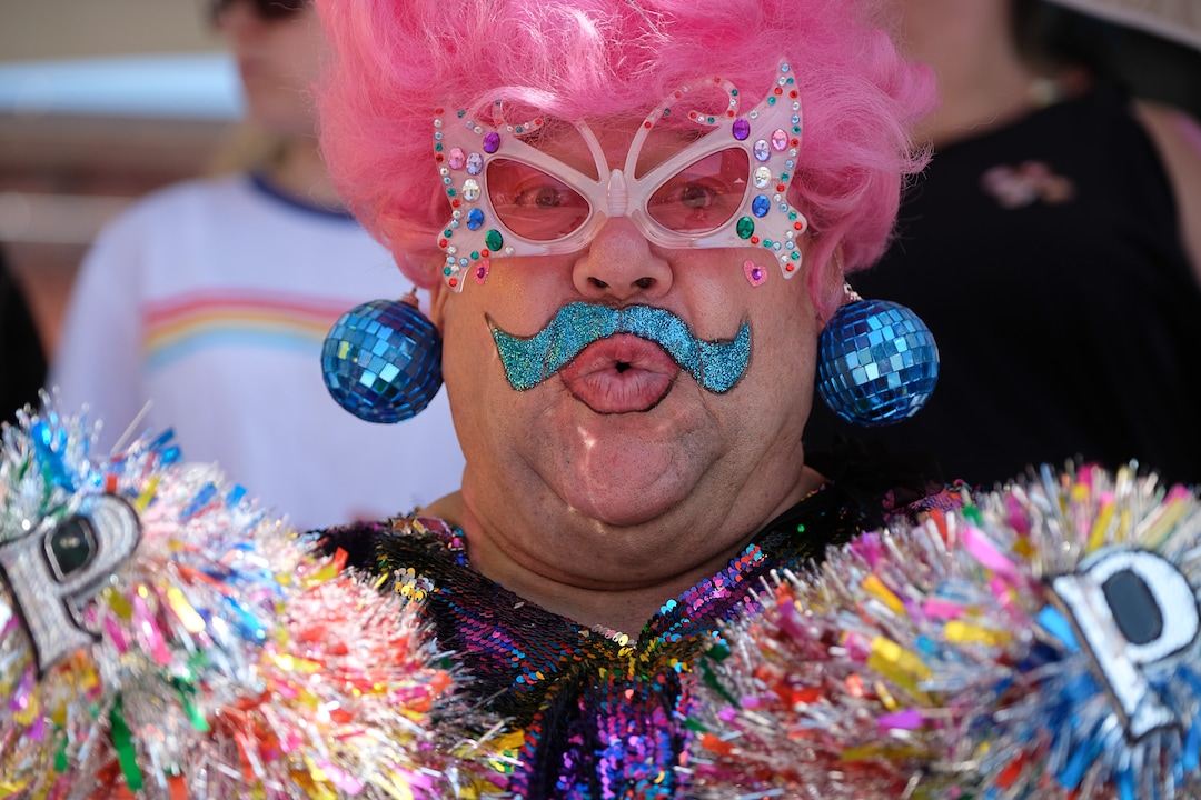 (Francisco Kjolseth  |  The Salt Lake Tribune)  Petunia Pap Smear keeps an eye on the festivities while joining thousands participating in the Utah Pride Parade in Salt Lake City on Sunday June 2, 2019.
