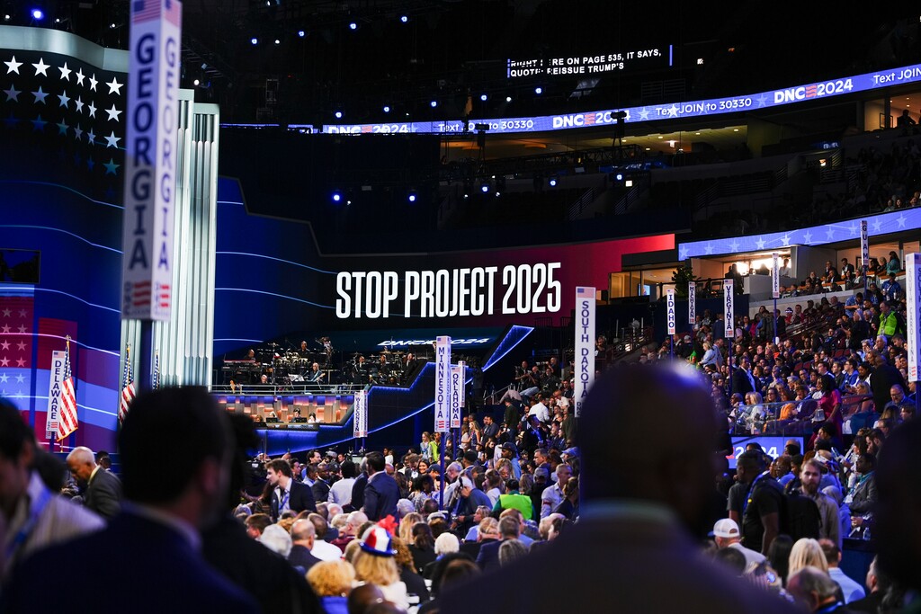 (Jamie Kelter Davis | The New York Times) An LED board displays a message reading "Stop Project 2025" on the first day of the Democratic National Convention in Chicago, on Aug. 19, 2024. After a campaign in which Donald Trump swore he had Ònothing to do with Project 2025, and described some of its policy goals as "absolutely ridiculous," he has recruited at least a half dozen architects and supporters of the plan to oversee key issues.