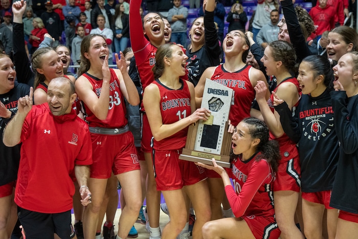 (Rick Egan | The Salt Lake Tribune) The Bountiful Redhawks celebrate their win over the Springville Red Devils, for the Girls 5A State Championship at Weber State, on Saturday, March 4, 2023.
