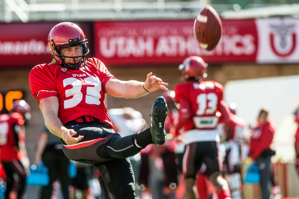Chris Detrick  |  The Salt Lake TribuneUtes punter Mitch Wishnowsky (33) kicks the ball during a practice at Rice-Eccles Stadium Tuesday April 5, 2016. 