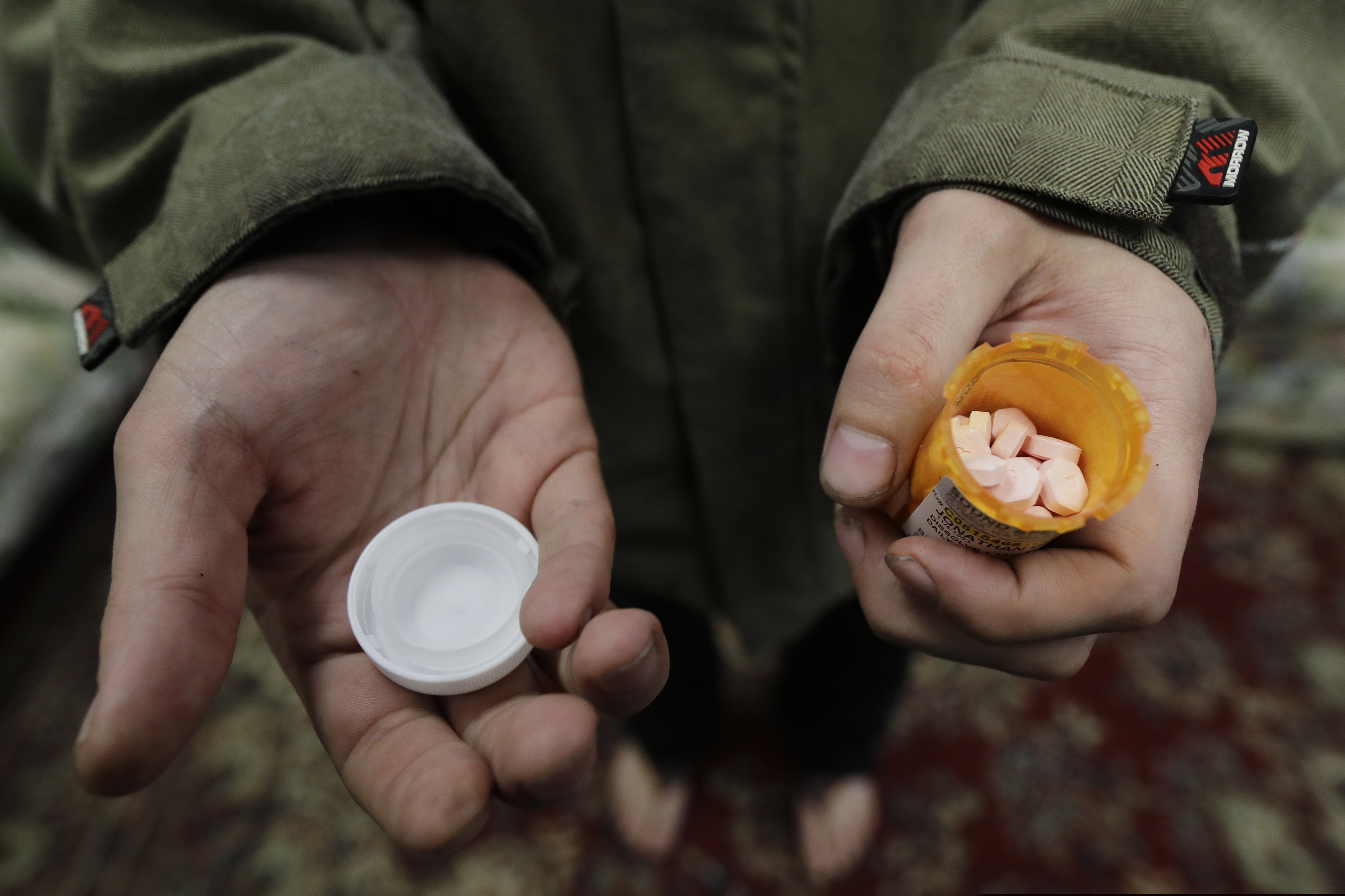(Ted S. Warren | AP photo)

In this Nov. 14, 2019, photo, Jon Combes holds his bottle of buprenorphine, a medicine that prevents withdrawal sickness in people trying to stop using opiates, as he prepares to take a dose in a clinic in Olympia, Wash.