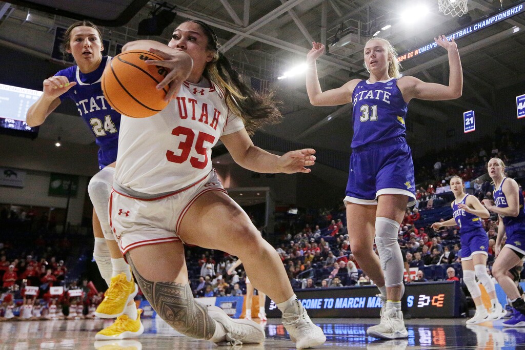 (Young Kwak | AP) Utah forward Alissa Pili (35) tries the keep the ball in play next to South Dakota State forwards Mesa Byom (24) and Brooklyn Meyer (31) during the first half of a first-round college basketball game in the women's NCAA Tournament in Spokane, Wash., Saturday, March 23, 2024.