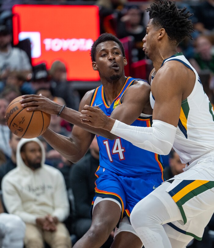 (Rick Egan | The Salt Lake Tribune) Oklahoma City Thunder forward, Jaylen Hoard (14), tries to get past Utah Jazz center Hassan Whiteside (21), in NBA action between the Utah Jazz and the Oklahoma City Thunder at Vivint Arena, on Wednesday, April 6, 2022.
