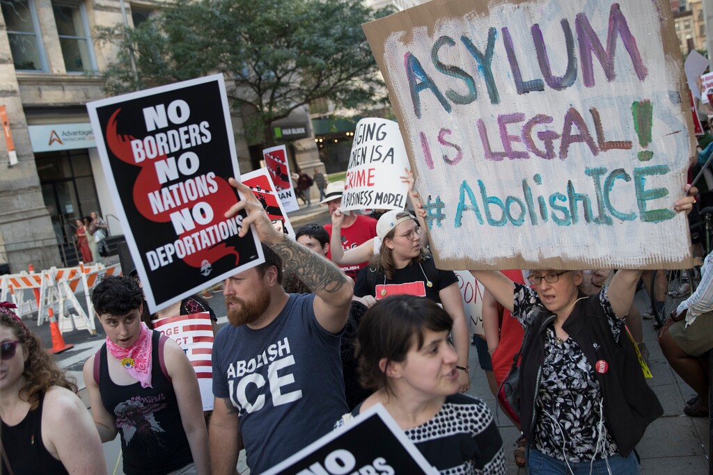 Protesters chant slogans outside a Federal court during a demonstration calling for the abolishment of Immigration and Customs Enforcement, or ICE, and demand changes in U.S. immigration policies, Friday, June 29, 2018, in New York. (AP Photo/Mary Altaffer)