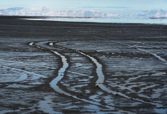 (Steve Griffin / Tribune file photo)  Car tracks in the mud at the end of the road at Bonneville Salt Flats International Speedway, seen here in January 2017.