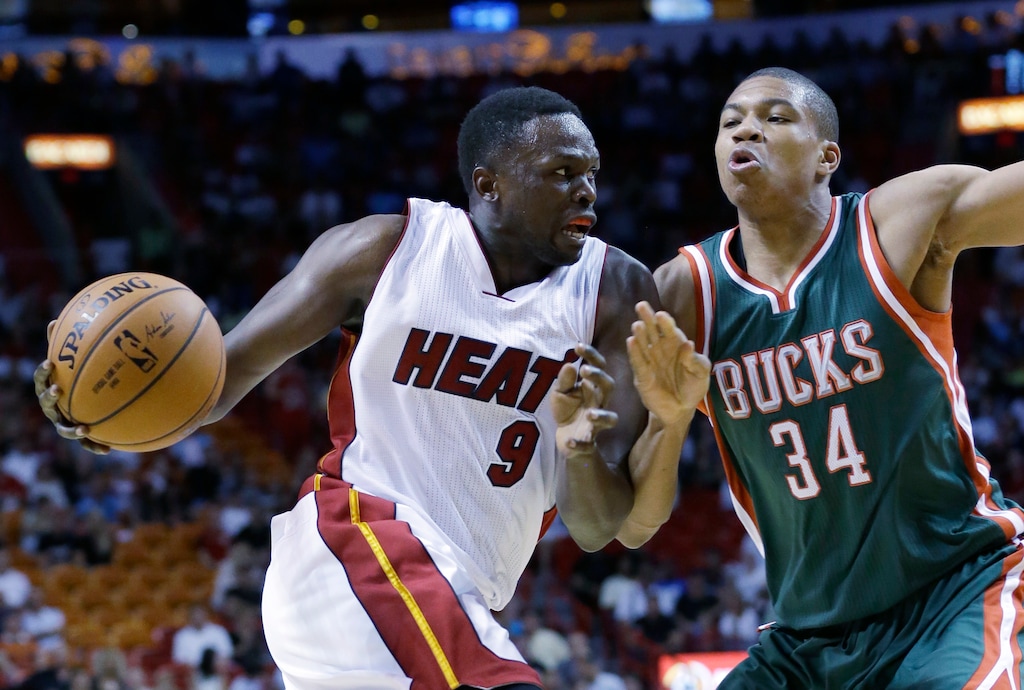 Miami Heat forward Luol Deng (9), of Sudan, drives against Milwaukee Bucks guard Giannis Antetokounmpo (34), of Greece, during the first half of an NBA basketball game, Sunday, Nov. 16, 2014, in Miami. (AP Photo/Wilfredo Lee)
