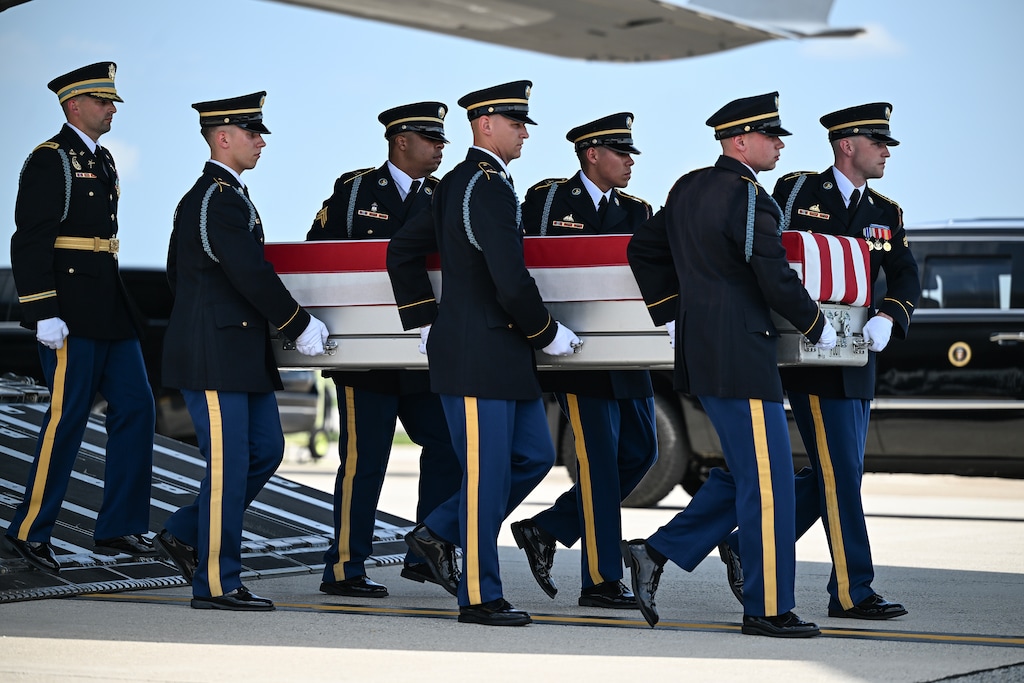 (Kenny Holston | The New York Times) The transfer case of a U.S. soldier is carried during a dignified transfer for soldiers killed amid the conflict with Iran at Dover Air Force Base in Delaware, on Wednesday, July 22, 2026. Three military officials said that one reason behind for why the number of Americans killed in the Iran war had changed was that the Trump administration decided to remove four service members killed this past weekend from the list — three in Jordan and one in northern Iraq — because their deaths occurred after President Trump declared a cease-fire in the war in April.