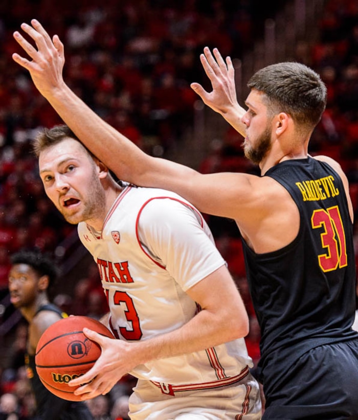 (Trent Nelson | The Salt Lake Tribune)  USC Trojans forward Nick Rakocevic (31) defends Utah Utes forward David Collette (13) as the University of Utah hosts USC, NCAA basketball at the Huntsman Center in Salt Lake City, Saturday Feb. 24, 2018.