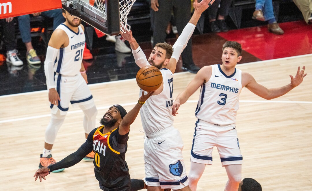 (Rick Egan | The Salt Lake Tribune) Utah Jazz guard Mike Conley (10) takes the ball to the ihoop, as Memphis Grizzlies center Jonas Valanciunas (17) and Memphis Grizzlies guard Grayson Allen (3) defend, in NBA Playoff game 2, between the Utah Jazz and the Memphis Grizzlies at Vivint Arena, on Wednesday, May 26, 2021.