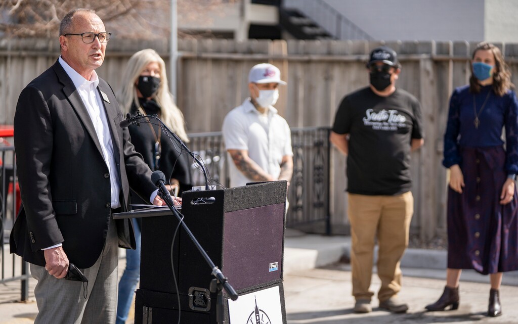 (Rick Egan | Tribune file photo) Mark Jenson, of Harmon's Grocery, speaks at a news conference along with Salt Lake City Mayor Erin Mendenhall, encouraging citizens to keep wearing masks, after the state mask mandate ends, Friday, March 19, 2021.