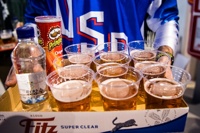 (Chris Detrick  |  The Salt Lake Tribune)  A USA fan carries nine beers, water and Pringles during the United States vs Olympic Athletes from Russia hockey game at Gangneung Hockey Centre during the Pyeongchang 2018 Winter Olympics Saturday, Feb. 17, 2018. Olympic Athletes from Russia defeated United States 4-0.