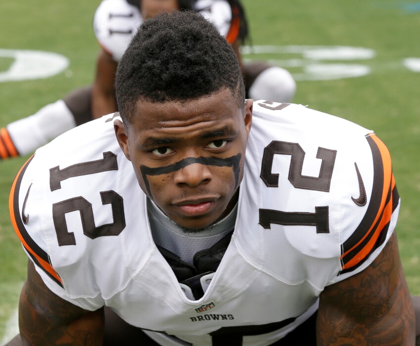 FILE - In this Dec. 21, 2014, file photo, Cleveland Browns' Josh Gordon (12) stretches before an NFL football game against the Carolina Panthers in Charlotte, N.C. If Josh Gordon is reinstated by the NFL, the Cleveland Browns appear ready to have the wide receiver return to the team. Sashi Brown, the Browns' executive vice president of football operations, said Thursday, Feb. 25, 2016, at the NFL combine that a meeting involving himself, new coach Hue Jackson and Gordon would help determine Gordon's future in Cleveland. (AP Photo/Bob Leverone, File)