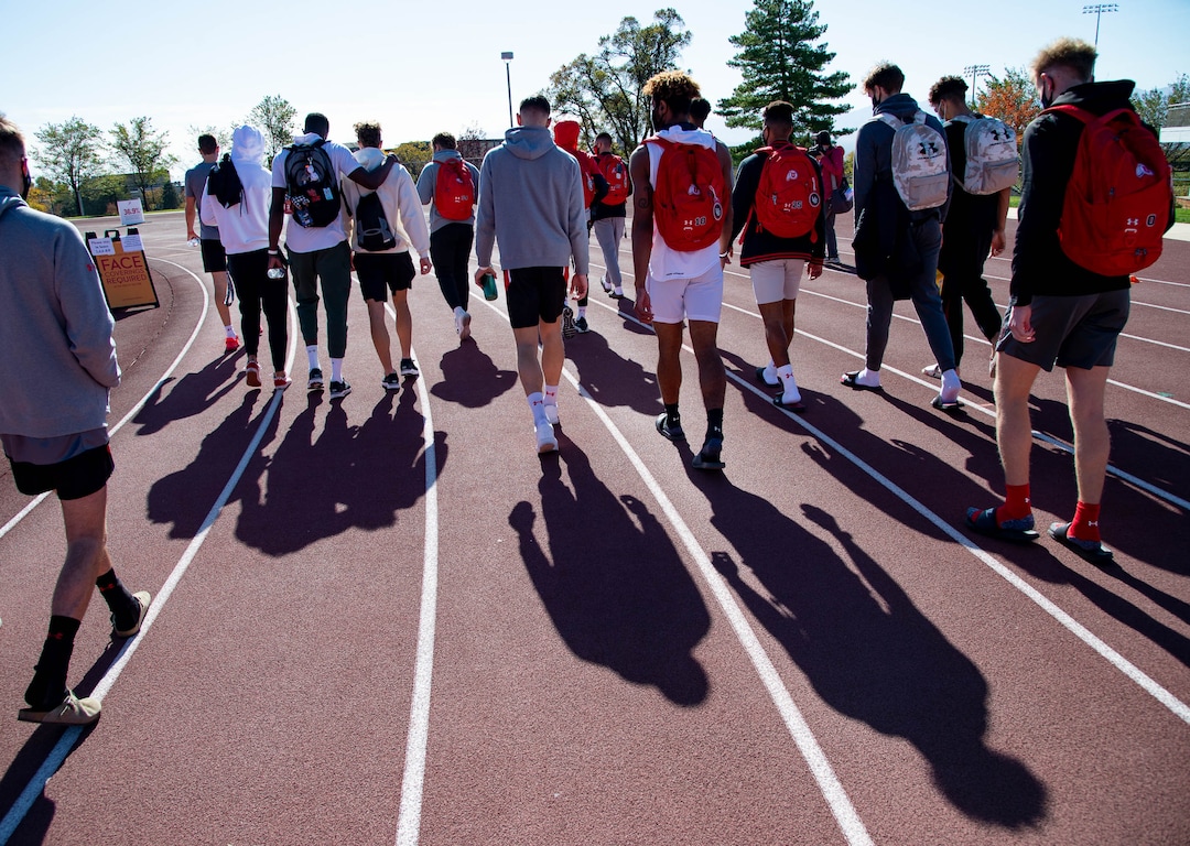 (Francisco Kjolseth  |  The Salt Lake Tribune) University of Utah basketball players walk in honor of Lauren McCluskey on the two-year anniversary of her murder, as they as they gather on the track where she used to compete on Thursday, Oct. 22, 2020.